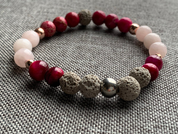 Bracelet élastique billes de verre roses alliage de métaux argent et pierres de lave grises Comme un ange
