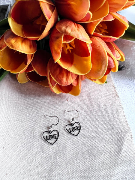 Boucles oreilles coeurs love noires Comme un ange