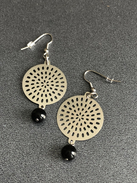 Round Mandala metal earring. Comme un ange