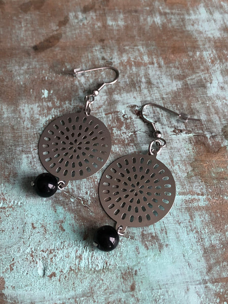 Round Mandala metal earring. Comme un ange