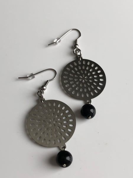 Round Mandala metal earring. Comme un ange