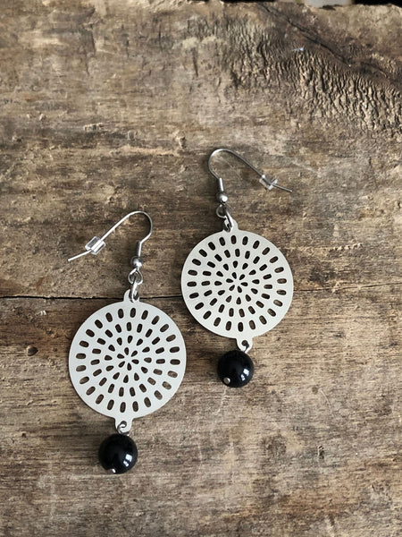 Round Mandala metal earring. Comme un ange