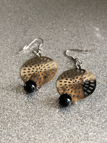 Round Mandala metal earring. Comme un ange