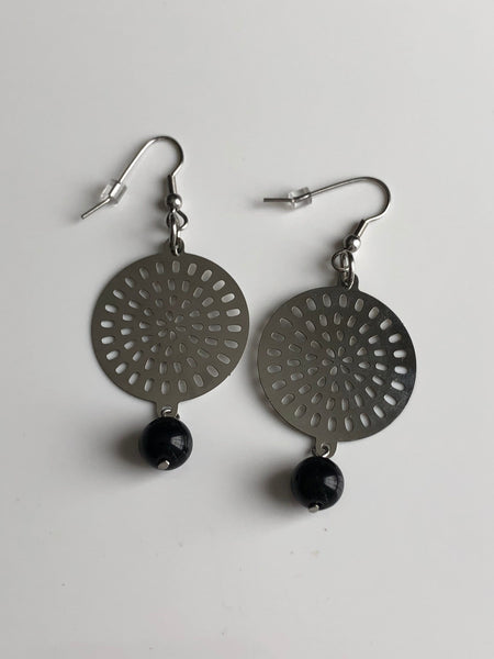 Round Mandala metal earring. Comme un ange