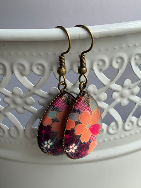 Boucles d’oreilles breloque de verre fleurs