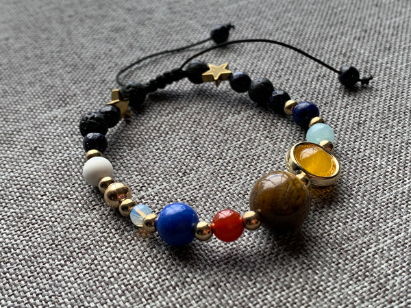 Bracelet ajustable espace et étoiles billes de verre Comme un ange