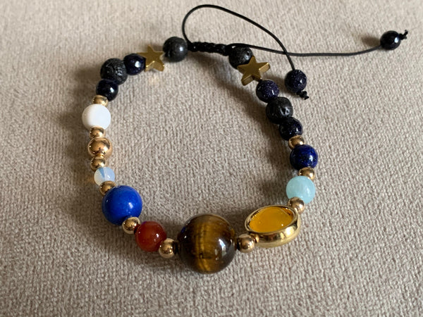Bracelet ajustable espace et étoiles billes de verre Comme un ange