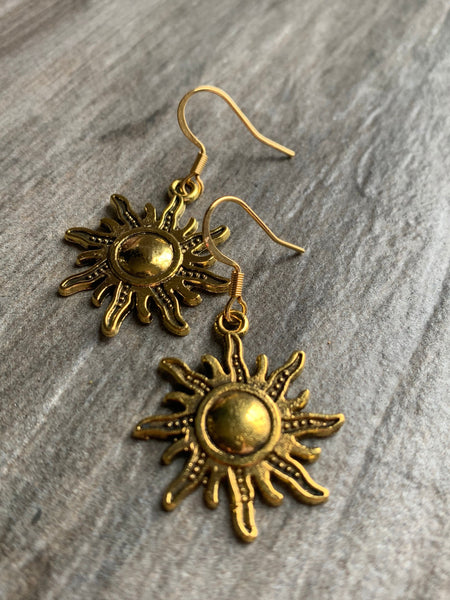Boucles d’oreilles breloque soleil or alliage de métaux Comme un ange