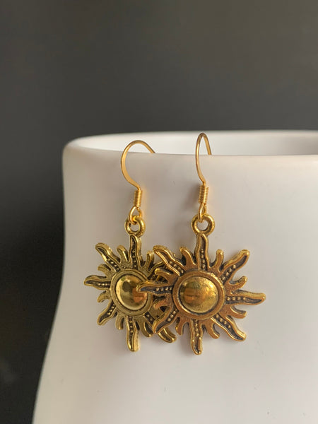 Boucles d’oreilles breloque soleil or alliage de métaux Comme un ange