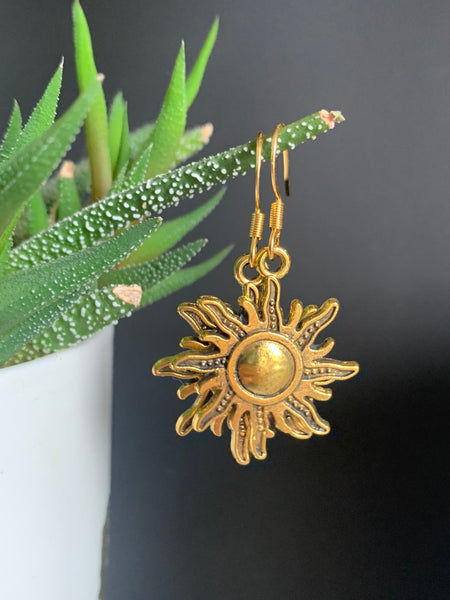 Boucles d’oreilles breloque soleil or alliage de métaux Comme un ange