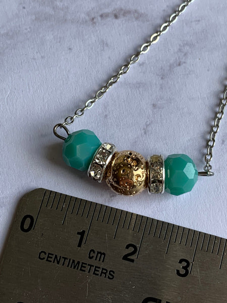 Collier pierre de lave ton or et billes turquoises  bijoux diffuseur Comme un ange
