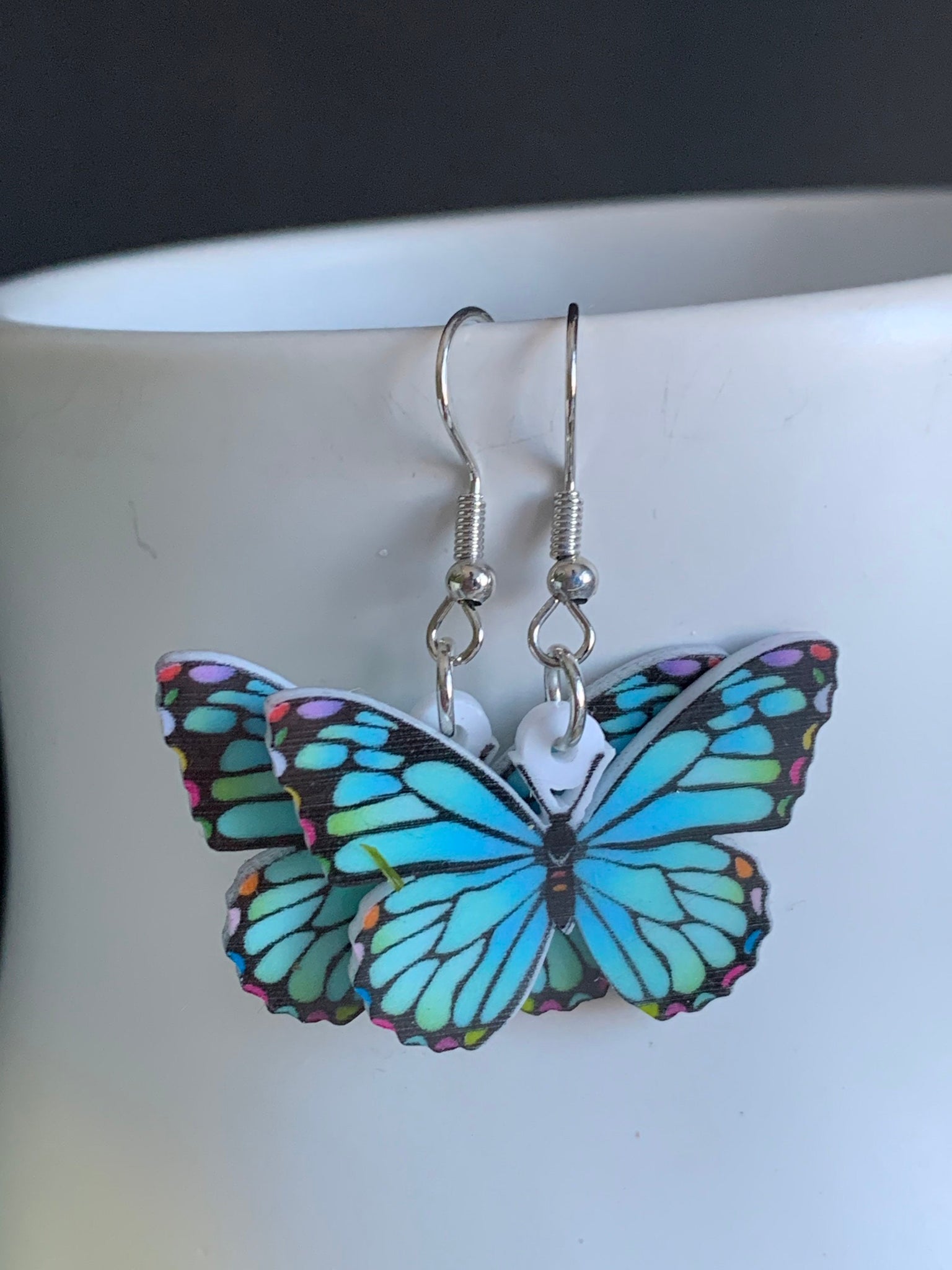 Boucles d’oreilles breloque papillon bleu sur crochet alliage de métaux argent Comme un ange