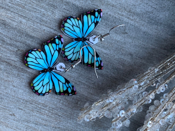 Boucles d’oreilles breloque papillon bleu sur crochet alliage de métaux argent Comme un ange