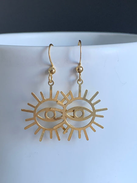Boucles d’oreilles breloque œil soleil or Comme un ange