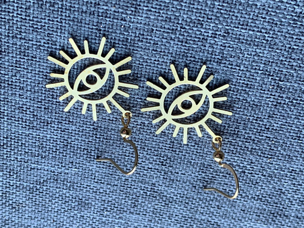 Boucles d’oreilles breloque œil soleil or Comme un ange