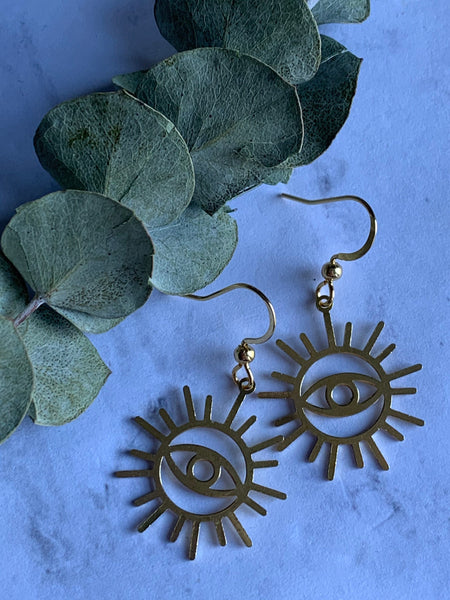 Boucles d’oreilles breloque œil soleil or Comme un ange