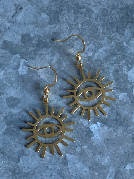 Boucles d’oreilles breloque œil soleil or Comme un ange