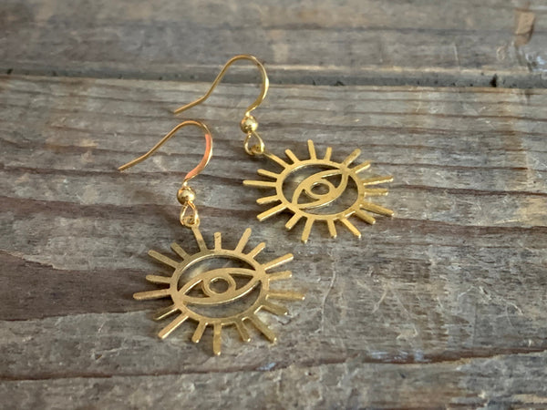 Boucles d’oreilles breloque œil soleil or Comme un ange
