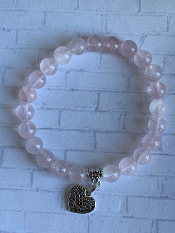 Bracelet quartz rose breloque coeur Comme un ange