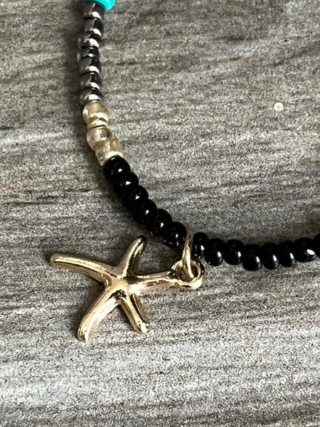 Collier petites billes étoile dorée Comme un ange