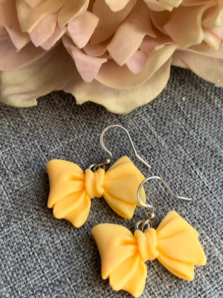 Boucles d’oreilles breloque boucles jaunes Comme un ange