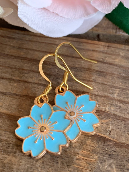 Boucles d’oreilles breloque fleur bleu sur crochet alliage de métaux or Comme un ange
