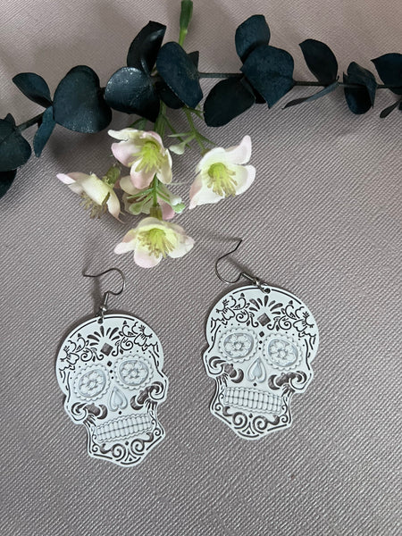 Boucles oreilles tête de squelette blanche Comme un ange