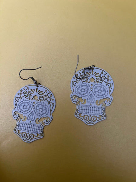Boucles oreilles tête de squelette blanche Comme un ange